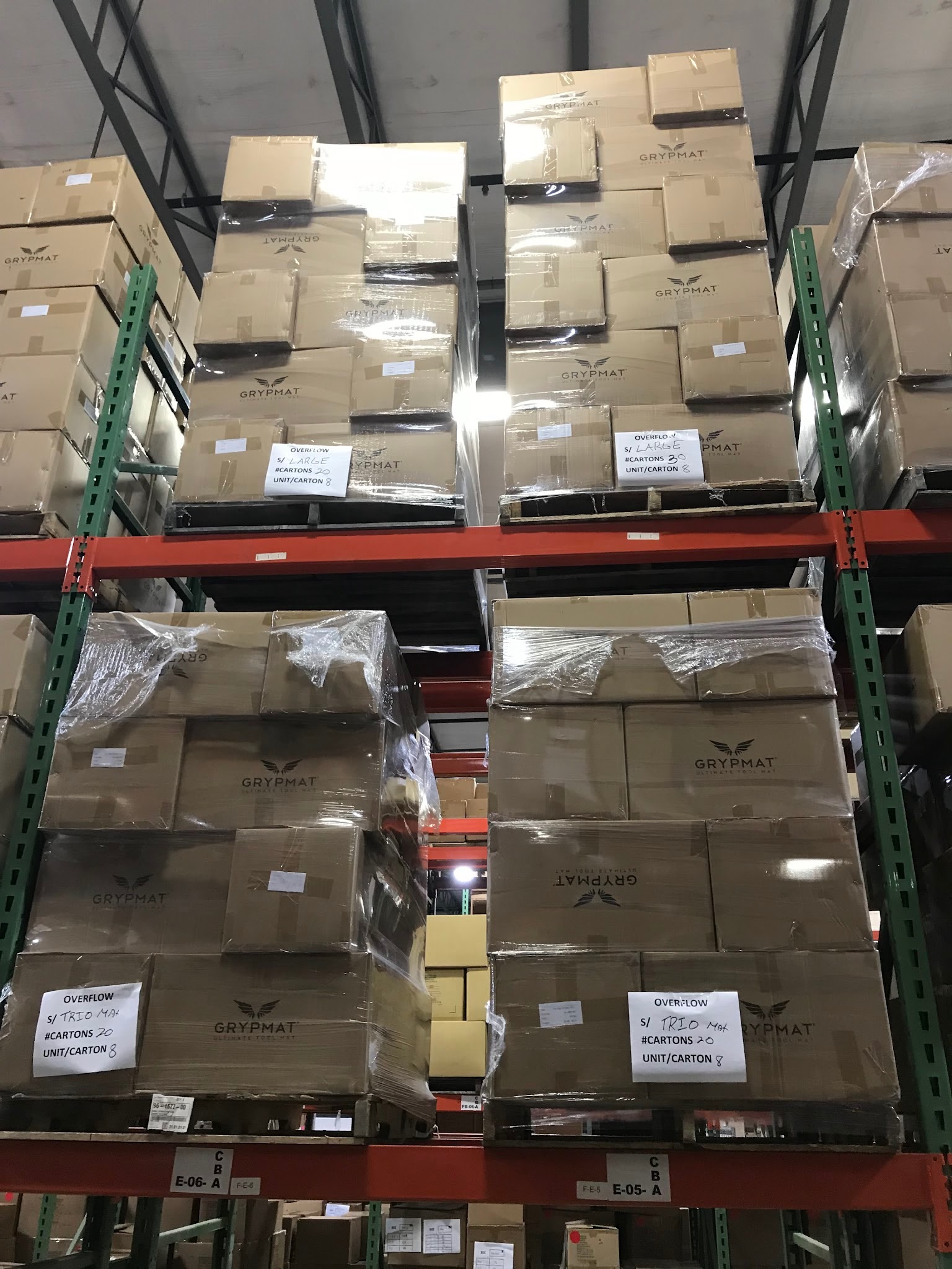 Shelves filled with boxed Grypmat orders