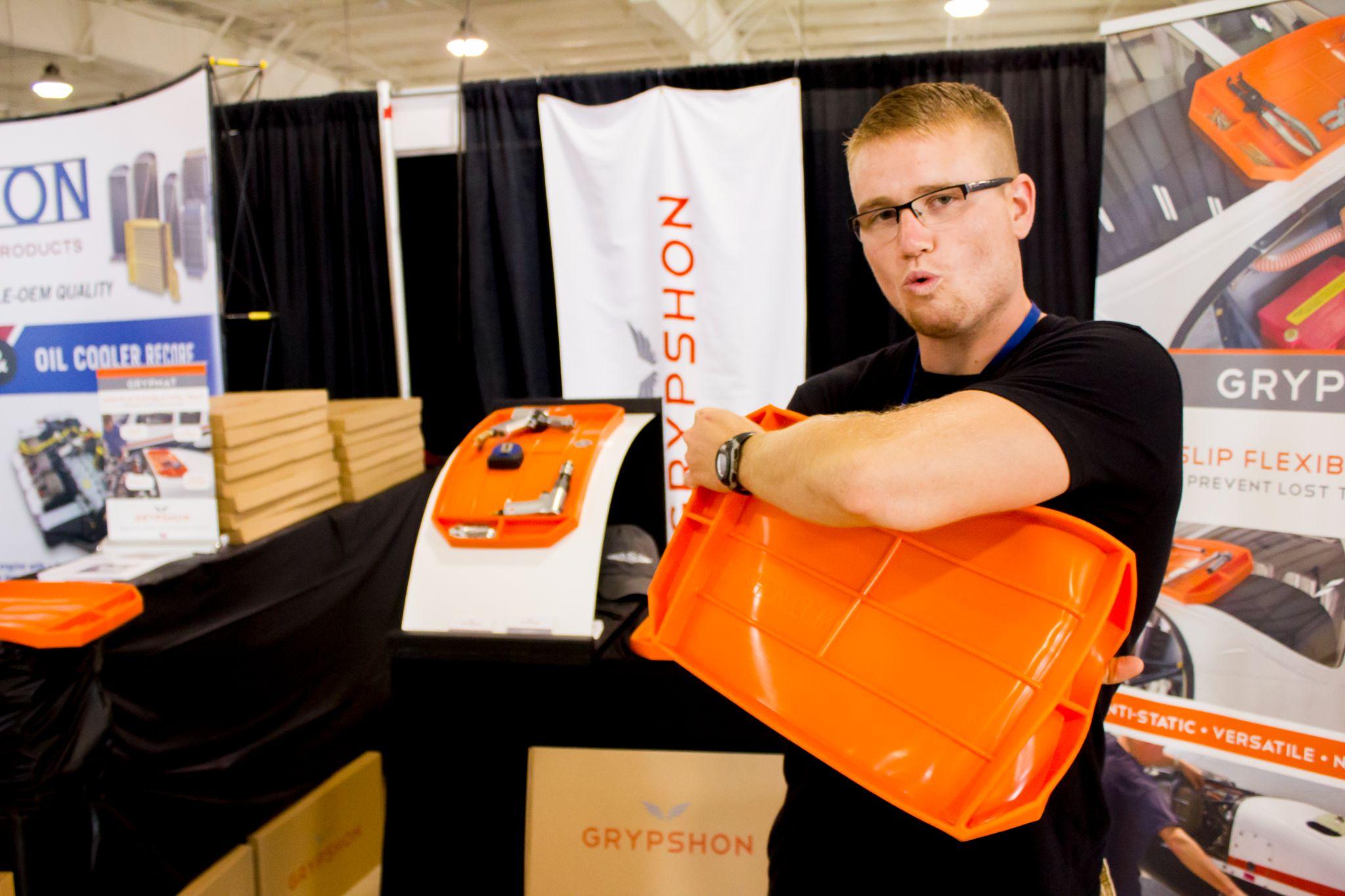 Tom demonstrating an orange Grypmat at an early trade show